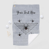 Dreieckiges Netz mit schwarzen Witwerspinnen auf W Golfhandtuch (Insitu)