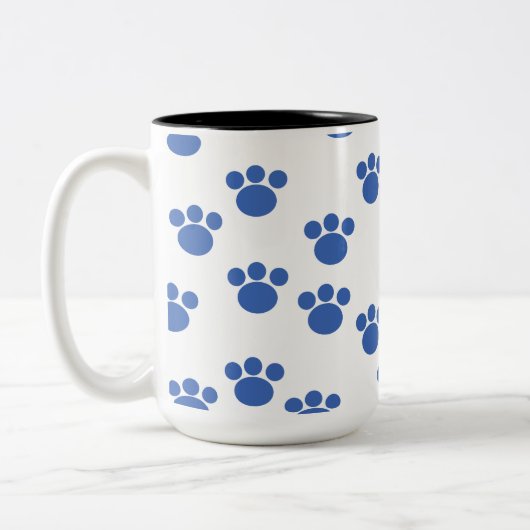 Druckmuster für Tierpaw. Blau und Weiß. Zweifarbige Tasse (Links)