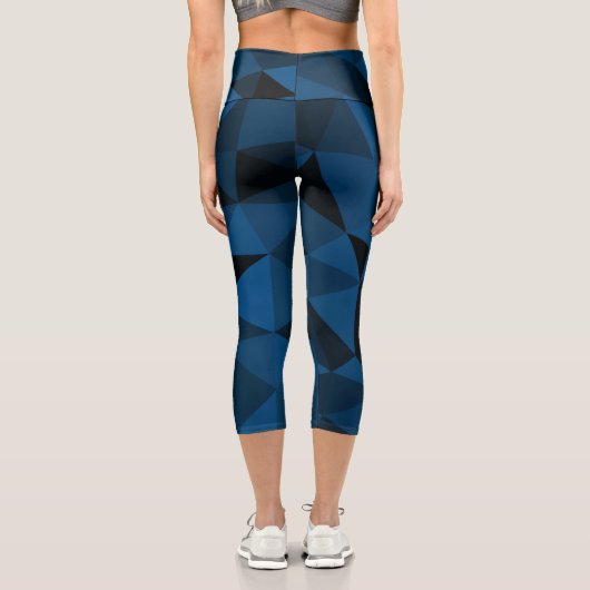 Dunkelblaues und schwarzes geometrisches Maschenmu Capri Leggings (Rückseite)