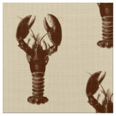Dunkelbraune Hummer auf hellbeige Stoff (Nahaufnahme)