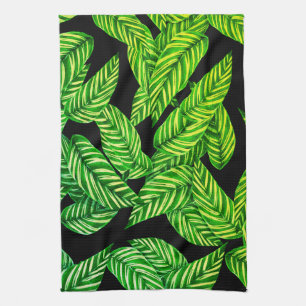 dunkelgrüne Blätter auf schwarz Geschirrtuch