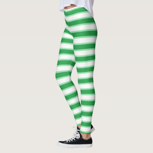 Dunkelgrüne, weiße und grüne Pastellstreifen Leggings (Links)