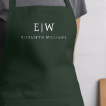 Dunkelgrünes Elegant Moderner Minimalistischer Mon Schürze<br><div class="desc">Erleben Sie kulinarische Erlebnisse mit unserer klassischen Elegant Moderne Minimalistische Monogram Name Cooking Schürze. Diese Küche ist unverzichtbar und vereint zeitlose Eleganz mit zeitgemäßem Minimalismus. Diese Schürze ist nicht nur ein praktisches Accessoire, sondern auch eine persönliche Note. Mit der individuell anpassbaren Monogramm- und Namensoption können Sie Ihre Persönlichkeit in Ihre...</div>