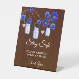 Dunkle rustikale blaue Flora Mason Jar Hochzeitsic Sockelschild