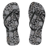 Dunkle schwarze Blütenpaare mit Flip Flops Badesandalen (Fußbett)