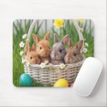 Easter Baby Bunnies in a Basket Mousepad<br><div class="desc">Four adorable bunnies are nestled in a white wicker basket with small flowers,  surrounded by brightly colored Easter eggs and vibrant blossoms in the grassy background</div>