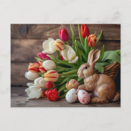 Easter bunny seated beside colorful eggs and tulip postkarte