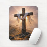 Easter Crosses On a Hill Mousepad<br><div class="desc">A central wooden cross,  covered with a white cloth and illuminated by the warm glow of the setting sun,  stands out against two additional crosses on a rocky hillside in the background</div>