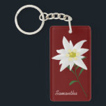 Edelweiss-Blume - kundenspezifische Schlüsselkette Schlüsselanhänger<br><div class="desc">Eine hübsche Schlüsselkette mit einer Grafik der weißen Blume Edelweiss,  Set auf dunkelrotem Hintergrund.  Weißer,  benutzerdefinierter Text ist bereit zur Personalisierung.  Gute Geschenkidee.</div>