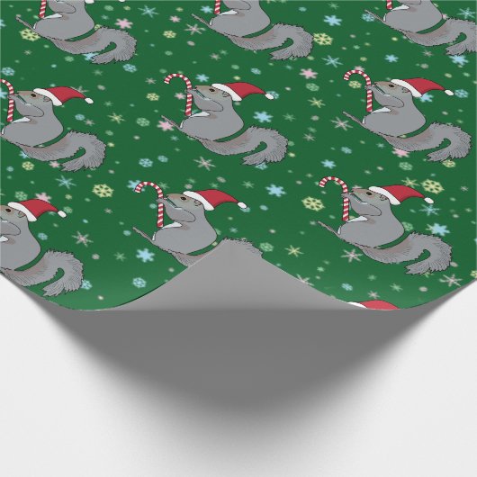 Eichhörnchen, das Zuckerstange hält und Geschenkpapier (Ecke)