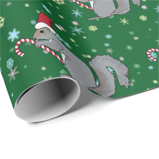 Eichhörnchen, das Zuckerstange hält und Geschenkpapier (Rolleneckpunkt)