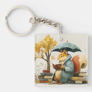 Eichhörnchen liest Bücher unter einem Regenschirm Schlüsselanhänger