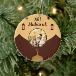 Eid Mubarak Photo Frame Mosque Skyline Art Keramik Ornament<br><div class="desc">Celebrate Eid with a beautiful design featuring elegant “Eid Mubarak” calligraphy, crescent moons, and lantern accents on a soft brown background. The central circular frame is designed as a photo space where you can add your own image, making the design more personal and meaningful. Mosque silhouettes along the bottom complete...</div>