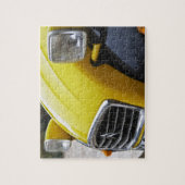 Ein altes schwarz-gelbes Citroen 2CV 2 CV, Detail Puzzle (Vertikal)