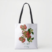 Ein Apfel-A-Day-Stil, der in einem grünen Foliage- Tasche (Vorderseite)