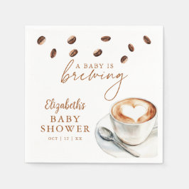 Ein Baby brütet eine Kaffeemaschine. Serviette