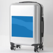 ein blauer Hintergrund mit Aufkleber (Koffer)