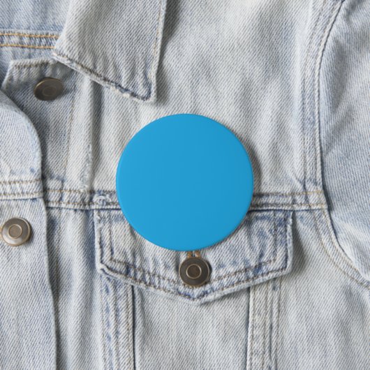 ein blauer Hintergrund mit einer schwarz-weißen Ka Button (Beispiel)