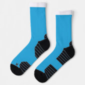 ein blauer Hintergrund mit einer schwarz-weißen Ka Socken (Links)