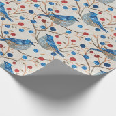 Ein blauer Vogel sitzt auf einem Zweig mit roten B Geschenkpapier (Ecke)