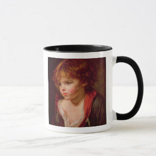 Ein blonder behaarter Junge mit einem offenen Tasse