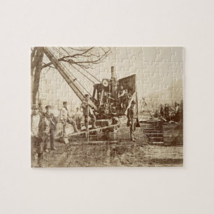Ein Dampfkran in Kraft während des Gebäude von Puzzle