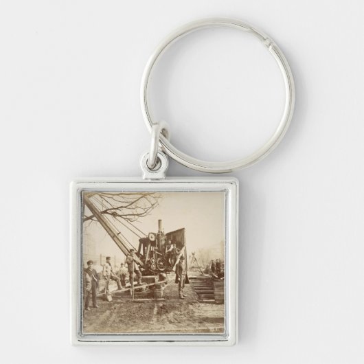 Ein Dampfkran in Kraft während des Gebäude von Schlüsselanhänger (Vorne)