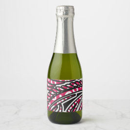 Ein dekoratives Paisley-Design mit lebhaftem Rot u Schaumweinetikett