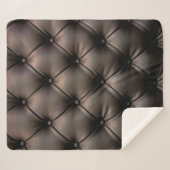 Ein dunkles Lederkissen, aus einem Kindersitz Sherpadecke (Vorderseite (Horizontal))