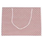 Ein gemusterter Teppich mit roten und braunen Moti Große Geschenktüte (Vorderseite)