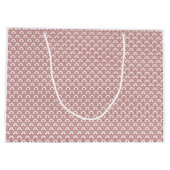 Ein gemusterter Teppich mit roten und braunen Moti Große Geschenktüte (Rückseite)