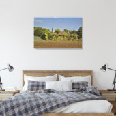 Ein gezüchtetes Feld vor Strohdächern Leinwanddruck (Insitu (Schlafzimmer))