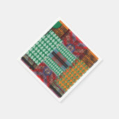 ein grün-schwarzes Muster mit einem Baum in der Mi Serviette (Ecke)