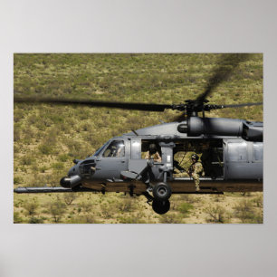 Ein HH-60 pflastern Falken fliegt über die Wüste Poster