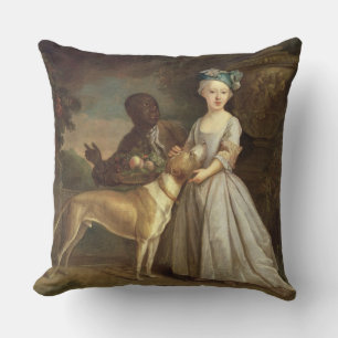 Ein junges Mädchen mit einem Hund und einer Seite Kissen