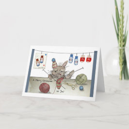 Ein Kaninchen, das einen Weihnachtshut knallt Karte