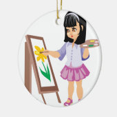 Ein kleines Mädchen mit einer Farben-Palette Keramikornament (Links)