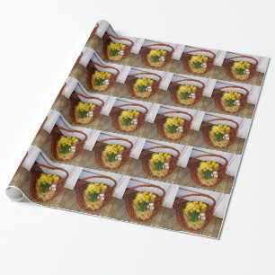 Ein Korb voller gelber Narzissen und florales Oste Geschenkpapier