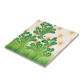 Ein künstlerisches Muster in Grün und Gold, das ei Fliese (Seite)