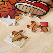 Ein lächelndes Kind, das im Herbst eine Eichel häl Puzzle (Seite)