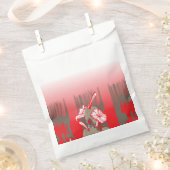Ein lebendiges Grafikdesign mit einem roten, gemus Geschenktütchen (Ausgeschnitten)