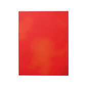 Ein lebendiges rotes Notizbuch mit einer subtilen Notizblock (Rotiert)