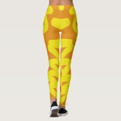 Ein lebhaftes orangefarbenes "Ratti_Creative_Arts" Leggings (Rückseite)