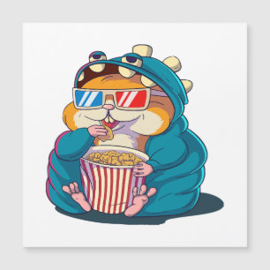 Ein lustiger Hamster, der eine Brille trägt, isst Magnetkarte