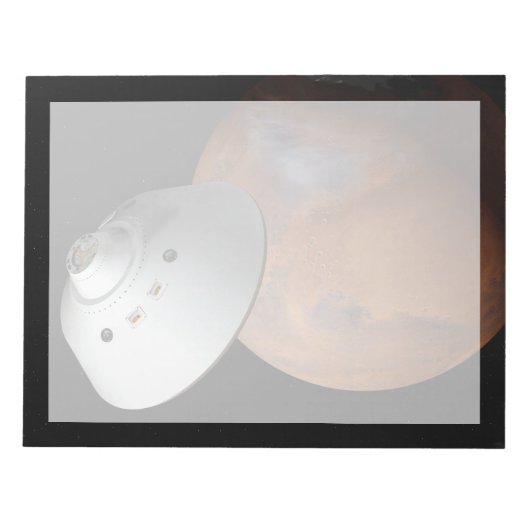 Ein mit Aeroshell angereichertes Raumfahrzeug nähe Notizblock (Vorderseite)