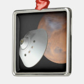 Ein mit Aeroshell angereichertes Raumfahrzeug nähe Ornament Aus Metall (Links)