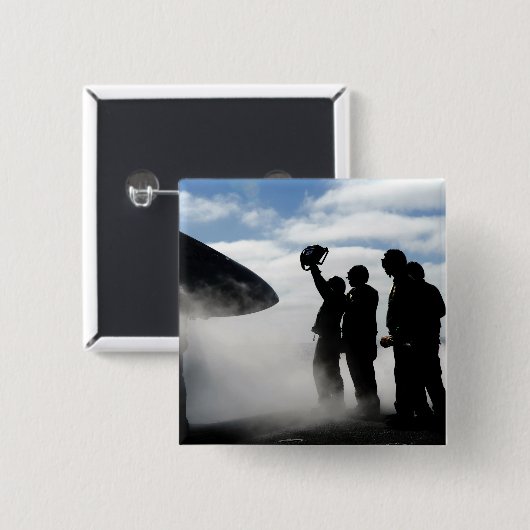 Ein Mitglied der Crew eines Cockpits Button (Vorne & Hinten)