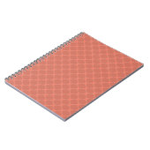 Ein monochromes dunkles oranges kleines geometrisc notizblock (Linke Seite)