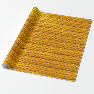 Ein Muster aus gelben Strickstoffen aus Garnen. Geschenkpapier
