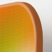 Ein orangefarbenes Pickleball-Paddle mit texturier Pickleball Schläger (Linke Seite)